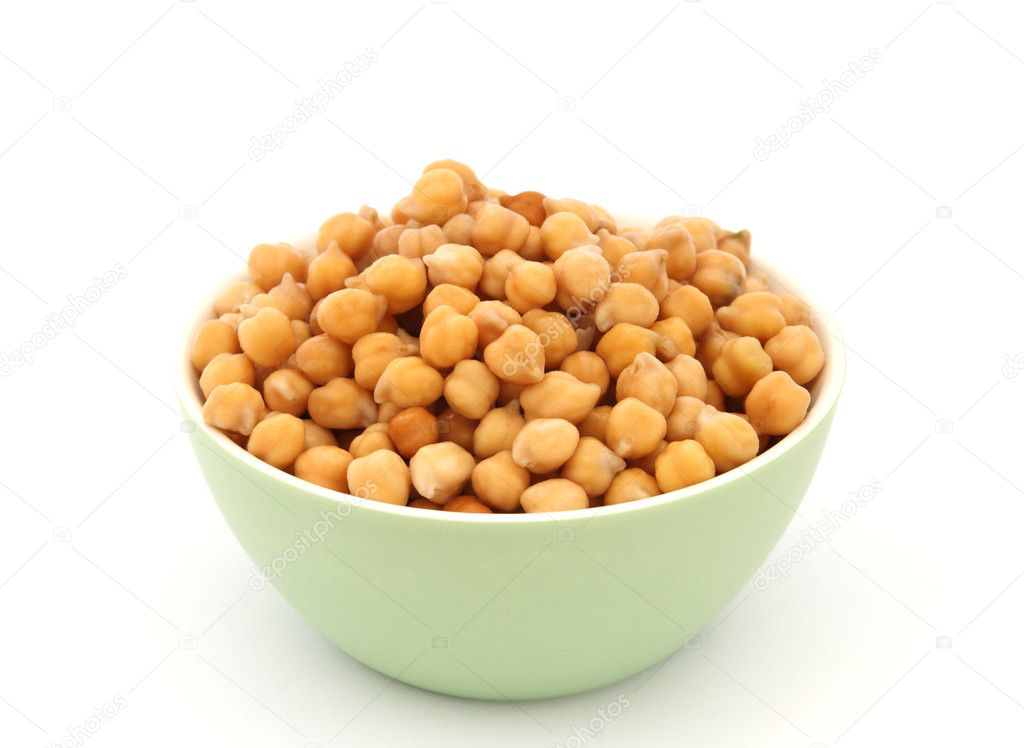 Close up view of chickpea in green bowl on white background