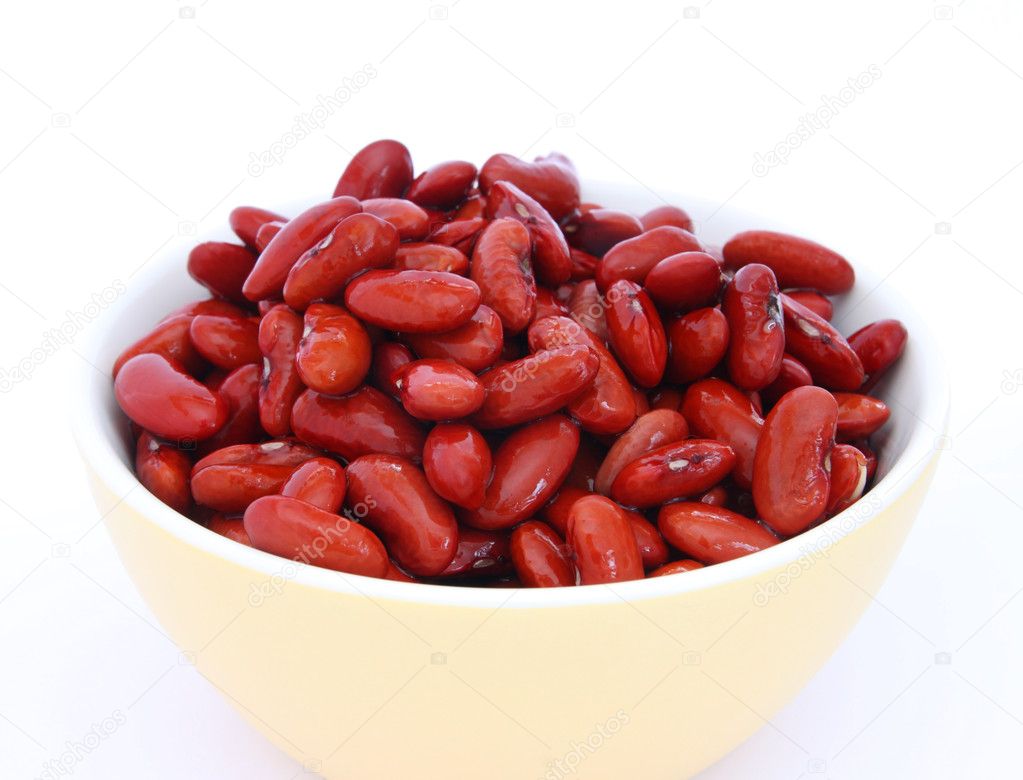 Many cooked red beans in yeallow bowl on white background