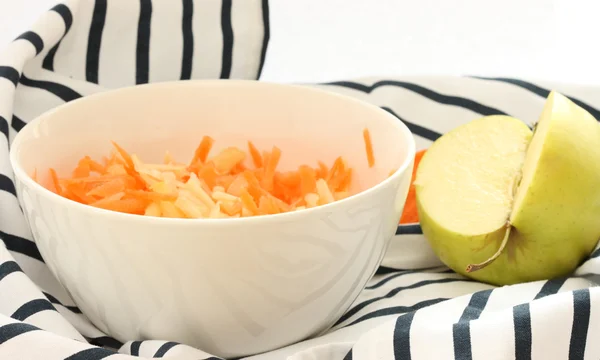 Grated carrot and apple in a bowl — Stock Photo, Image