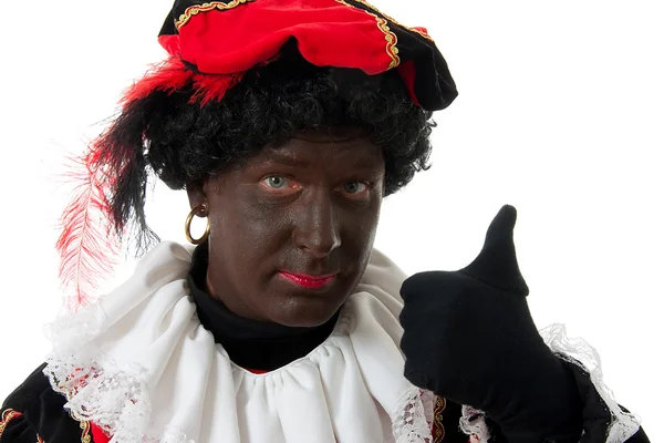 Zwarte Piet (black pete) caractere típico holandês com polegares para cima — Fotografia de Stock