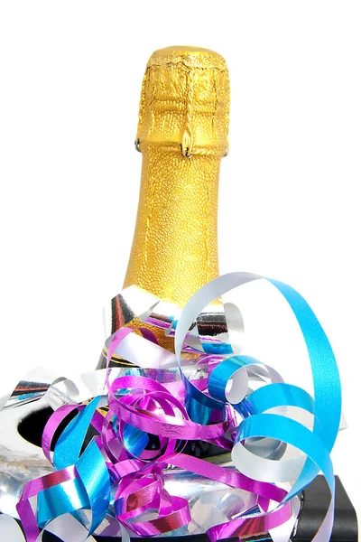 Neck of closed champagne bottle packed in golden paper — Stock Photo, Image
