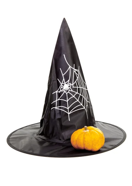 Black fabric witch hat with pumpkin for Halloween — Stock Photo, Image