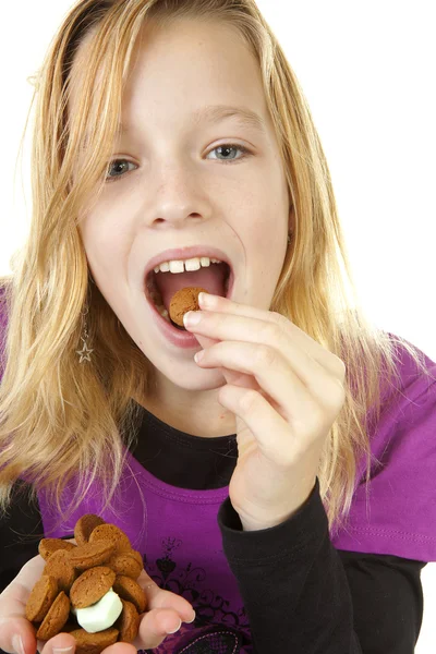Girl with ginger nuts (pepernoten) — Stock Photo, Image