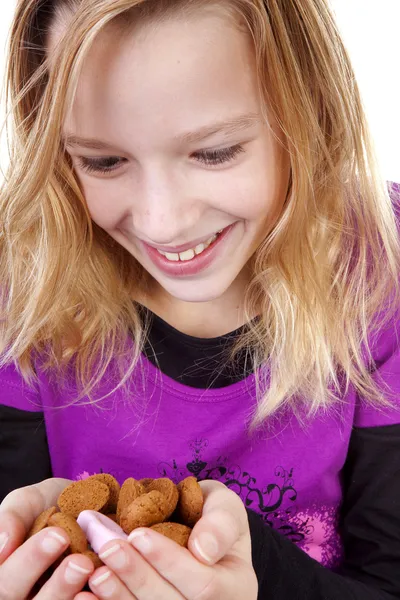 Girl with ginger nuts (pepernoten) — Stock Photo, Image