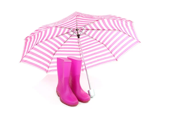 Rosa paraply och regn stövlar — Stockfoto