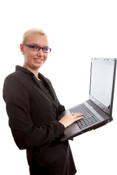 Secretária loira ocupada com laptop — Fotografia de Stock