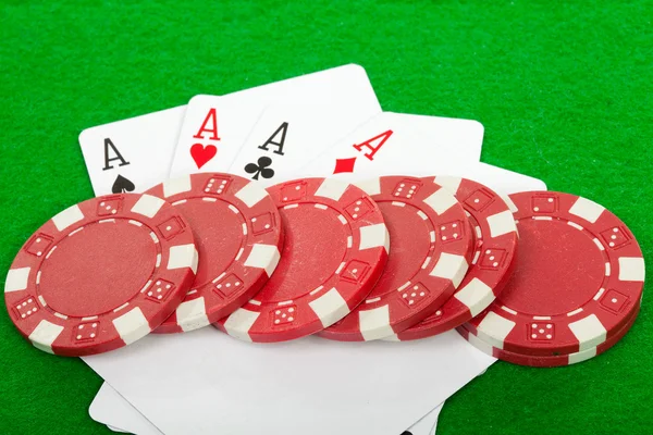 Winning poker hand of four aces playing cards and chips — Stock Photo, Image