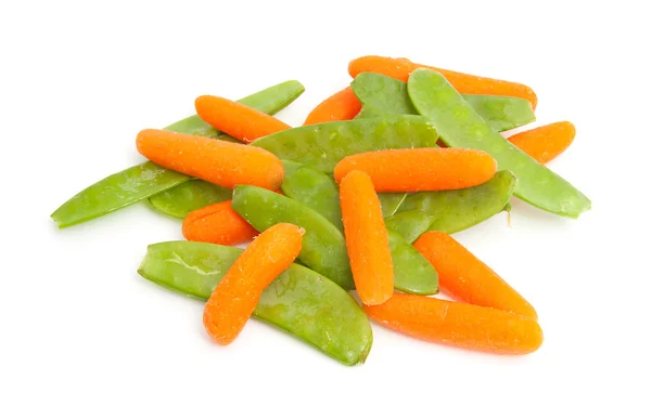 Pile of fresh carrots and snow peas — Stock Photo, Image
