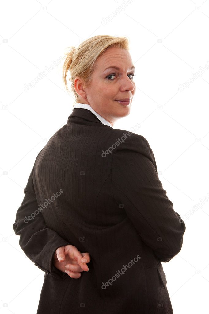 Liar businesswoman with crossed fingers at back over white background
