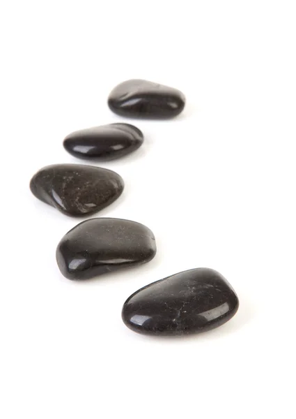 Czarne kamienie z rzędu — Zdjęcie stockowe