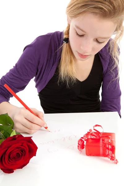 Young girl is writing be my valentine — Stock Photo, Image
