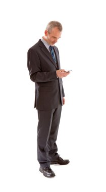 Older business man with smart phone over white background clipart