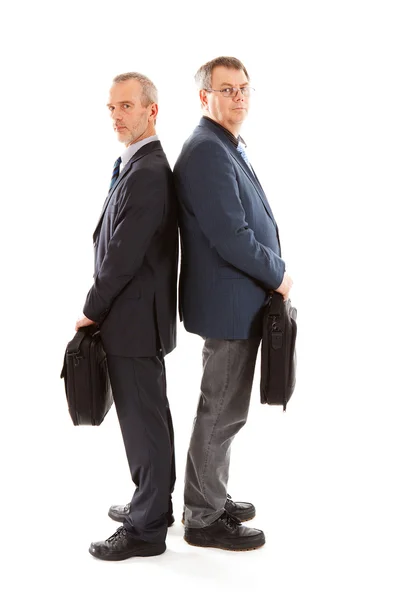 Dois homens de negócios de volta para trás com sacos de laptop — Fotografia de Stock