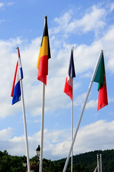 European flags against blue sky — Stock Photo, Image