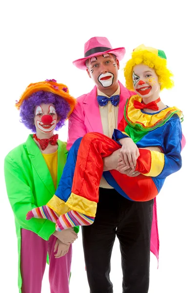 Three dressed up as colorful funny clowns — Stock Photo, Image
