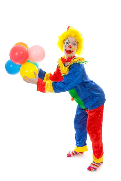 Criança vestida de palhaço engraçado colorido com balões — Fotografia de Stock
