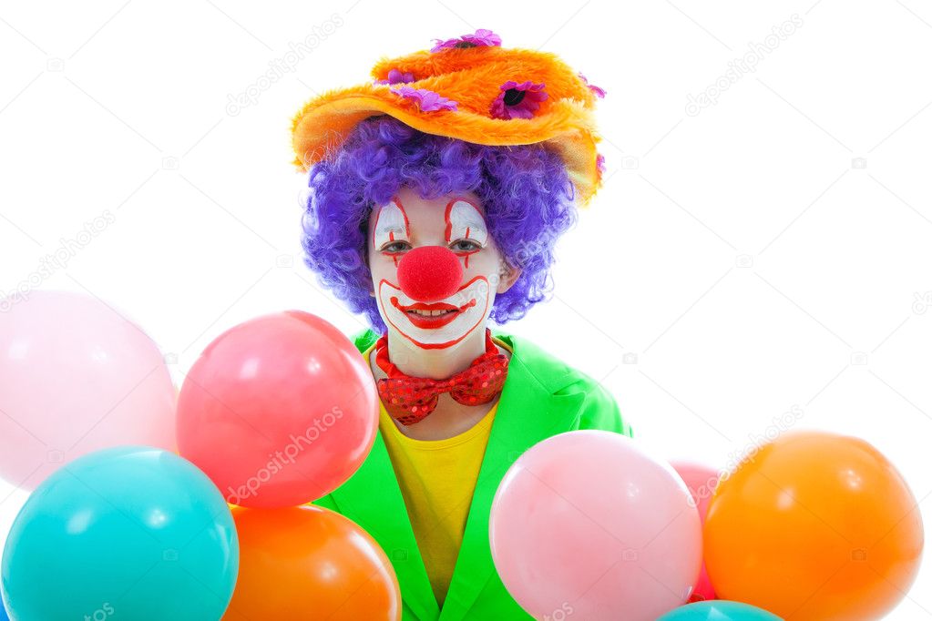Child dressed as colorful funny clown