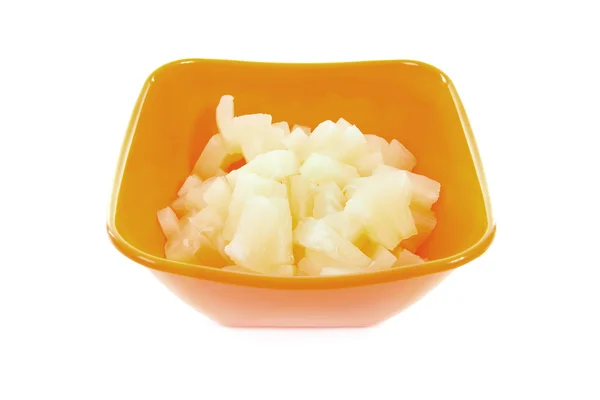 Orange bowl with diced pineapple — Stock Photo, Image