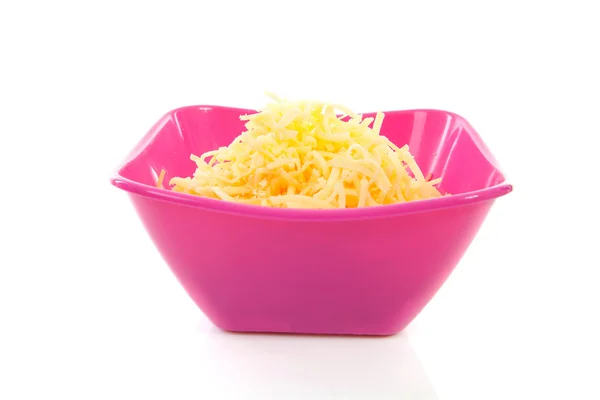 Pink bowl with grated cheese — Stock Photo, Image