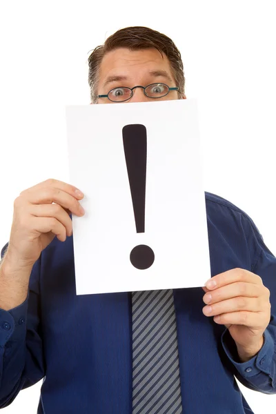 Male nerdy geek is holding text board with exclamation mark — Stock Photo, Image