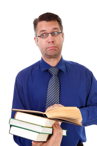 Male nerdy geek is reading books — Stock Photo, Image