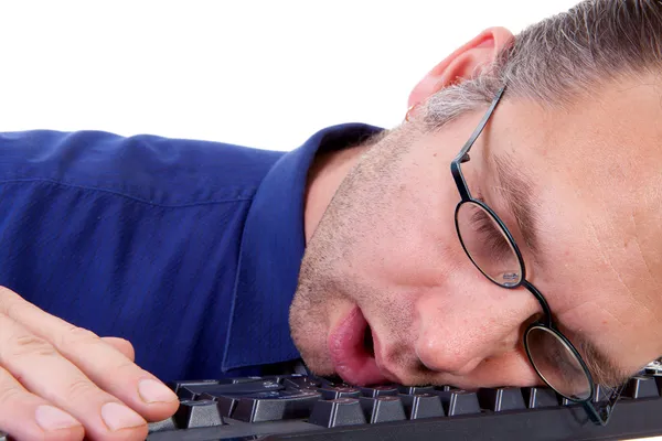 Male nerdy geek fall asleep on keyboard — Stock Photo, Image