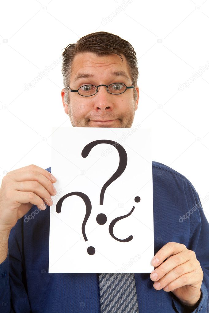 Male nerdy geek is holding text board with question marks