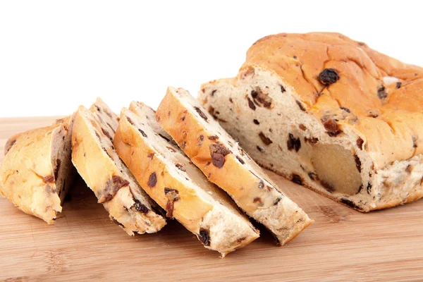 Rebanadas de pan en tabla de cortar de madera — Foto de Stock