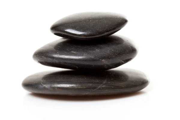 Pile of three black pebbles — Stock Photo, Image
