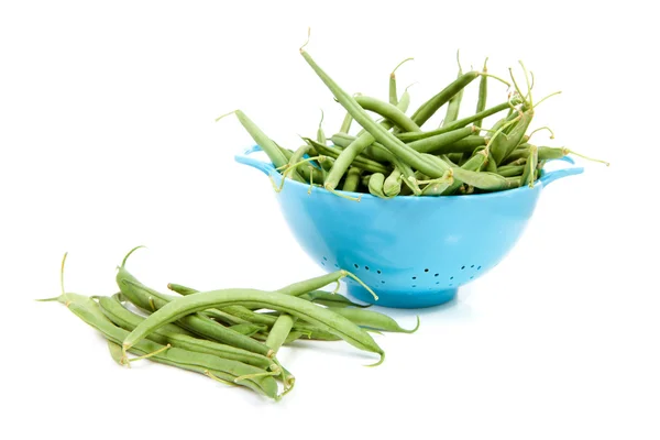 Blue colander with long green beans — Stock Photo, Image