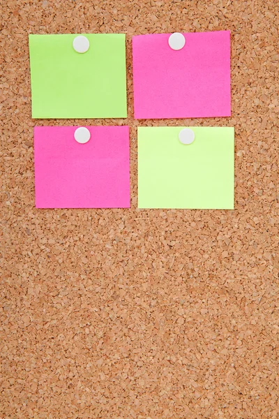 Blank sticky notes pinned on cork memo board — Stock Photo, Image