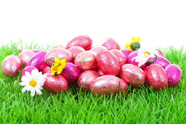 Pink easter eggs on grass — Stock Photo, Image