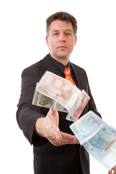 Бизнесмен бросает деньги в евро — стоковое фото