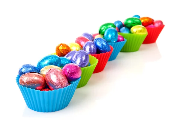 Colorful bowls with easter eggs — Stock Photo, Image