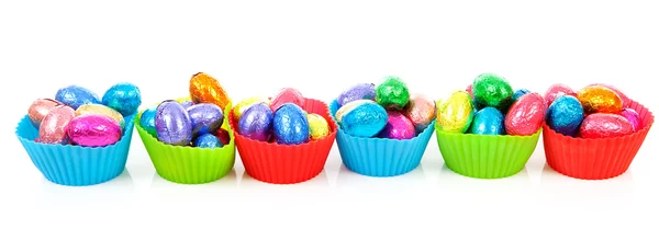 Colorful bowls with easter eggs — Stock Photo, Image