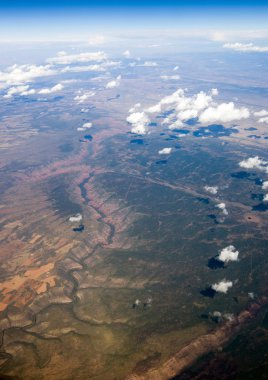 A birds eye aerial view of center pivot irrigation farming in the mid western United States of America. clipart