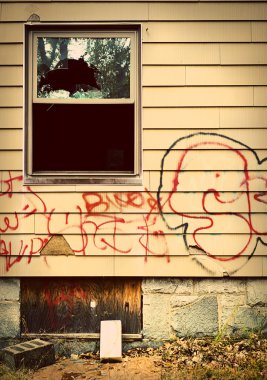 Run down house with graffiti clipart