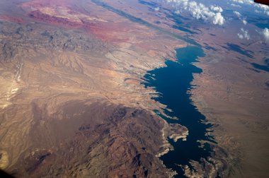 A birds eye aerial view of an unpopulated area of mountains and a river system in the United States of America. clipart