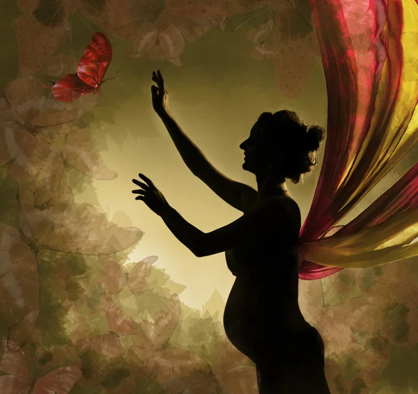 Mujer embarazada con alas atrapando mariposas. Fondo vintage — Foto de Stock