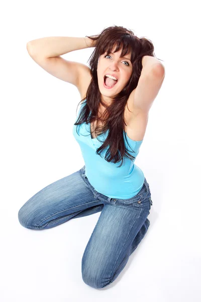 Screaming young woman holding head — Stock Photo, Image