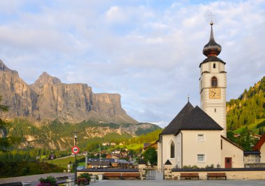 The Colfosco church and village, in italian Alps clipart