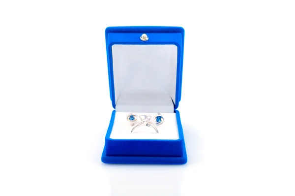 Luxury earrings in blue velvet jewelry box — Stock Photo, Image