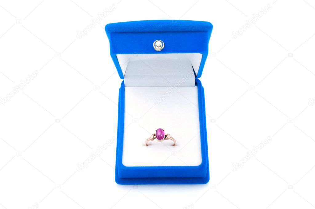 Gold ring with ruby in blue velvet jewelry box