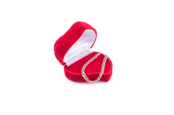 Złota bransoleta i czerwony prezent — Zdjęcie stockowe