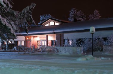 Hotel is a dark winter's night in Central Finland clipart