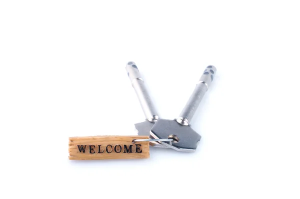 Conceito de boas-vindas com chave e etiqueta . — Fotografia de Stock