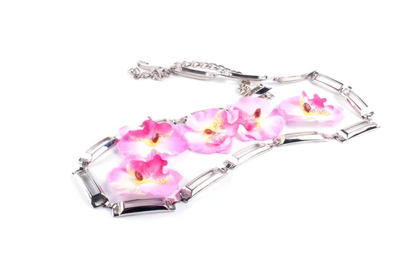 Pink orchid and necklace — Stock Photo, Image
