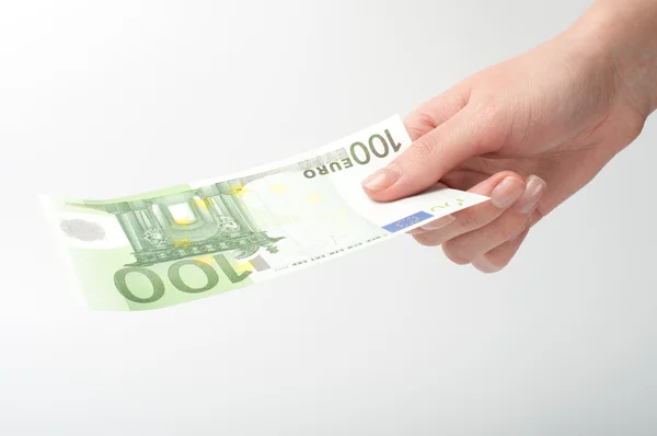 Банкнота евро крупным планом в руке — стоковое фото