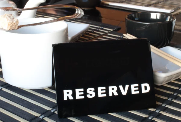 stock image Reserved sign on table in the sushi bar