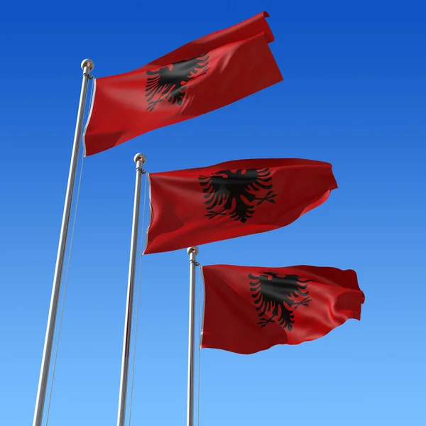 Τρεις σημαίες της Αλβανίας κατά της μπλε του ουρανού. 3D απεικόνιση. — Φωτογραφία Αρχείου